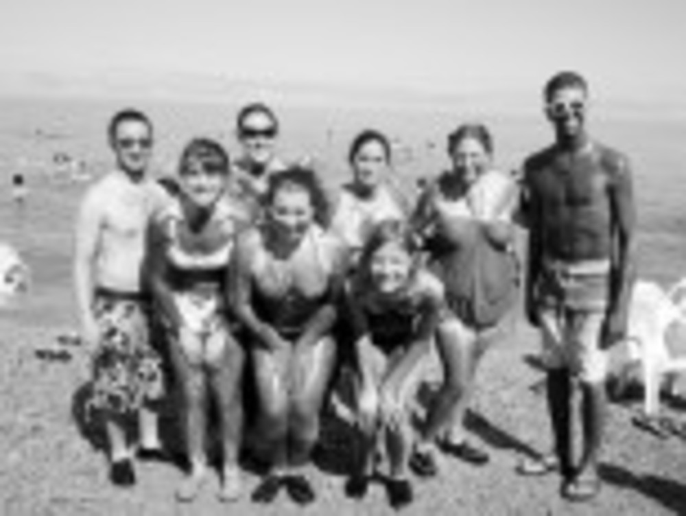 URI Hillel students – Eric Goldberg, back row, from left, Ali Sprague, Jackie Abrams, Kimmy Ross and Kyle Rottenberg; front row, from left, Alysa Redlich, Rebecca Korman and Taylor Broser – ‘mug’ for the camera at the Dead Sea this summer. /Alysa Redlich